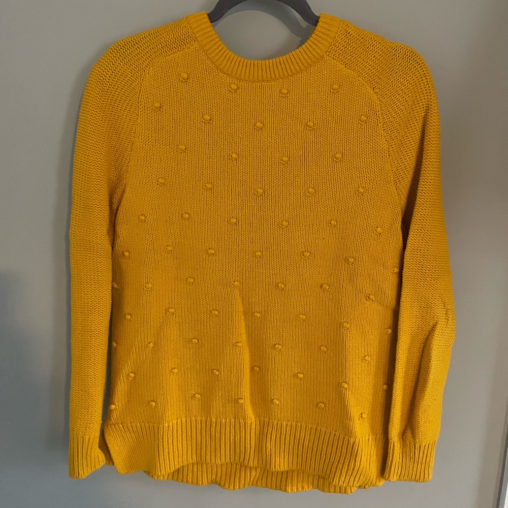 Orange sweater with dots